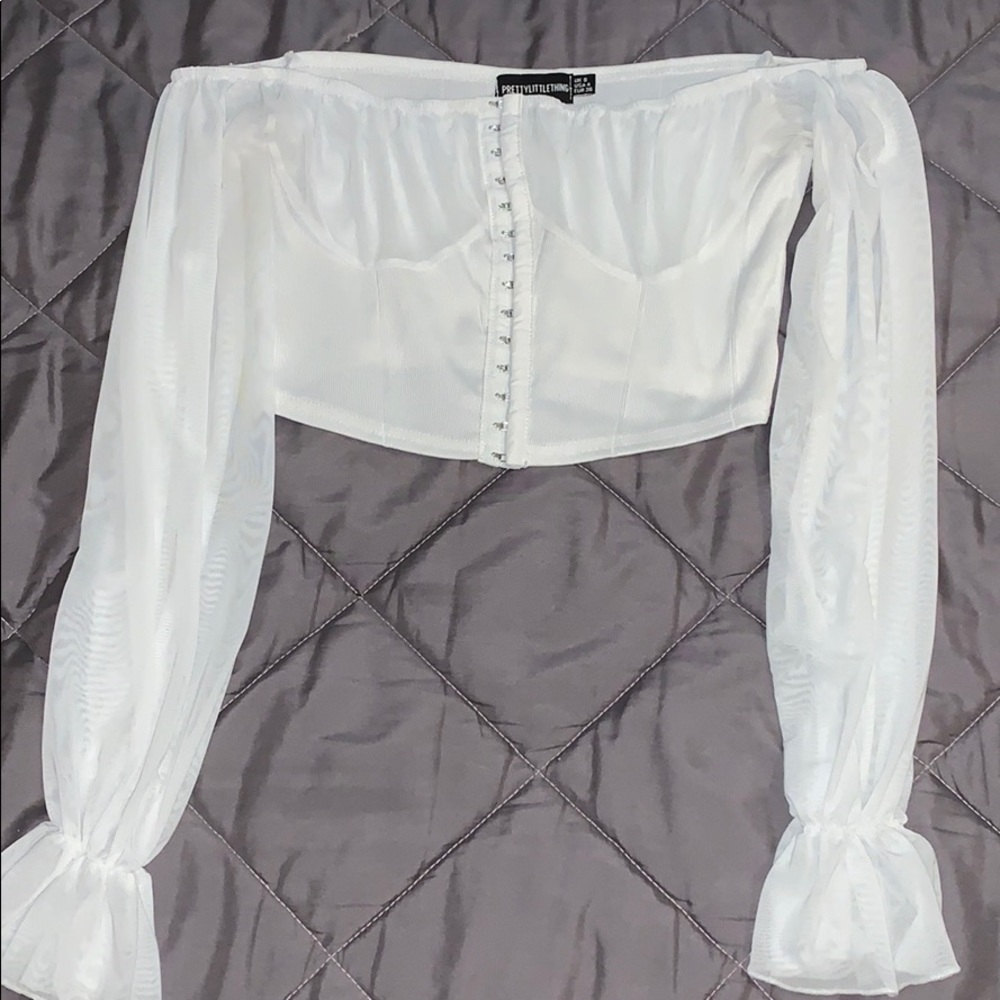 a long sleeve , crop top shirt